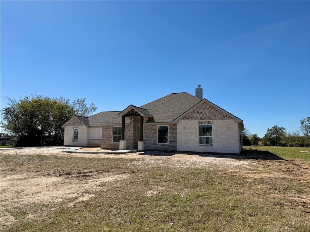 3245 Hunters Crossing Bryan, TX 77808 - Photo 3 of 26 a view of a house with a yard