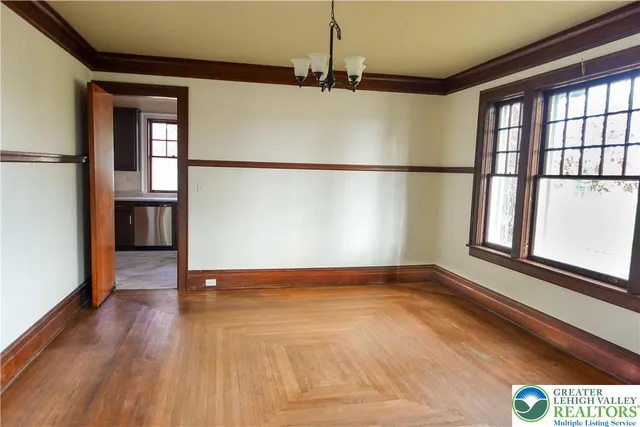 an empty room with a windows