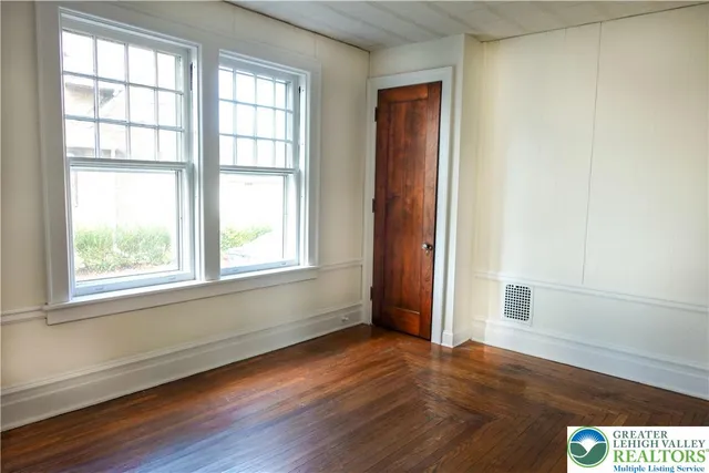 a front view of a house with a yard and a garage