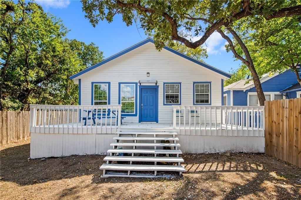 610 West 35th Street, Unit A Austin, TX 78705 - Photo 16 of 16 a view of a house with a small yard and wooden fence