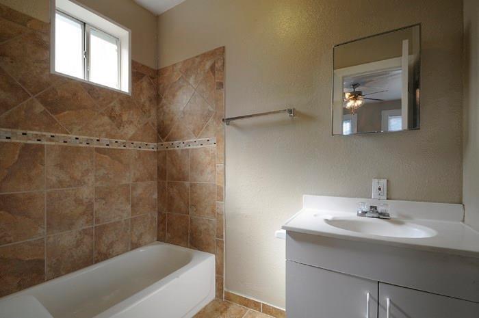 610 West 35th Street, Unit A Austin, TX 78705 - Photo 7 of 16 a bathroom with a sink and a mirror