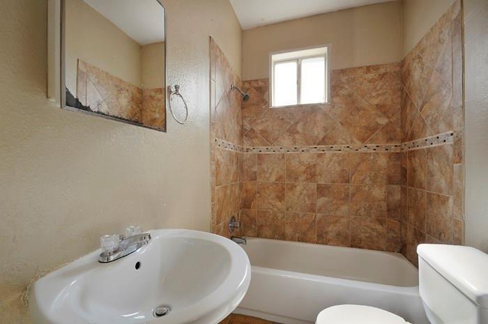 610 West 35th Street, Unit A Austin, TX 78705 - Photo 8 of 16 a bathroom with a bathtub and shower