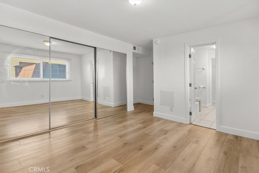 770 West Imperial Avenue El Segundo, CA 90245 - Photo 12 of 21 a view of an empty room with wooden floor and a window