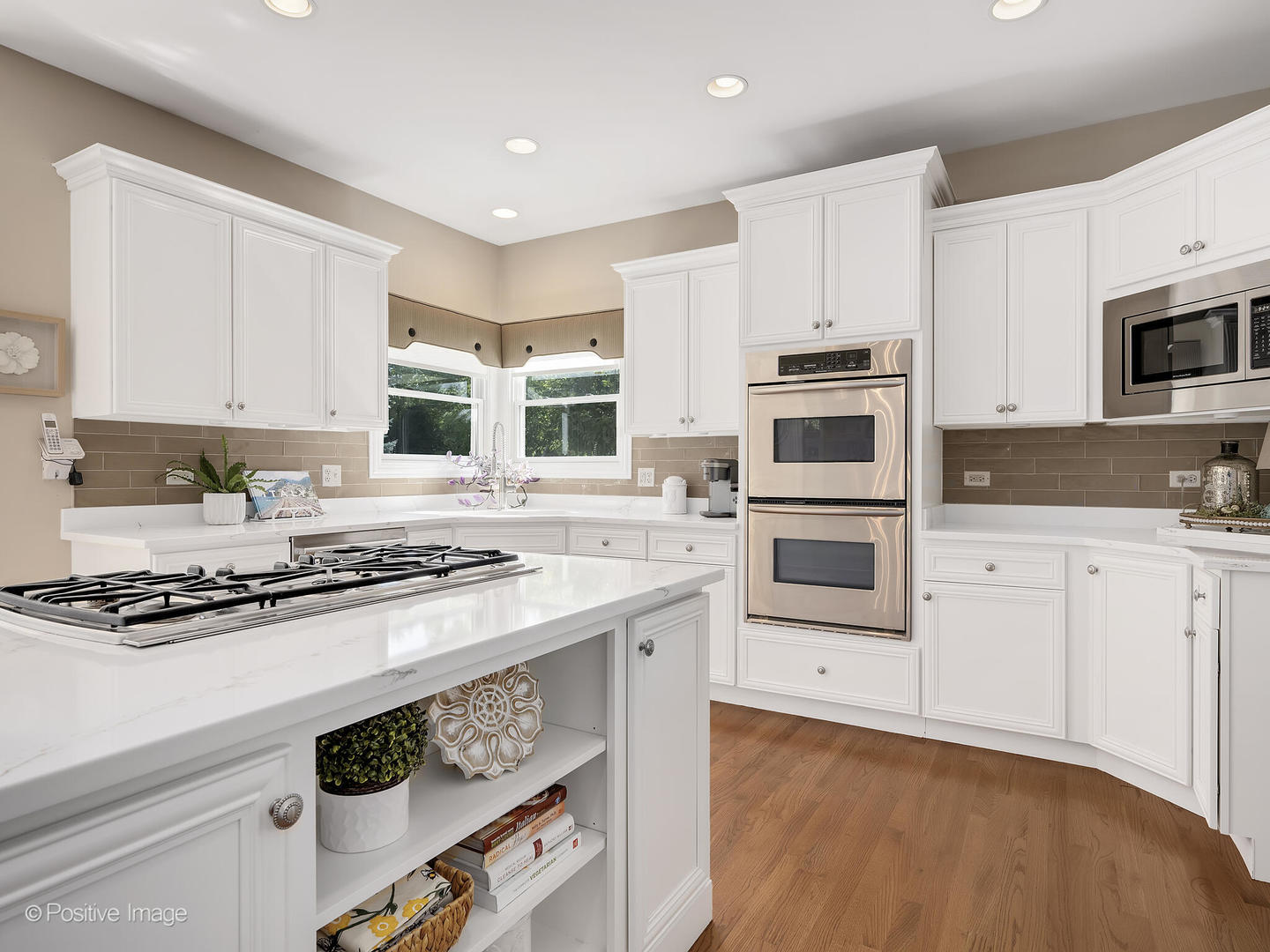 39-w740 Walt Whitman Road St. Charles, IL 60175 - Photo 14 of 39 a kitchen with granite countertop white cabinets and white appliances