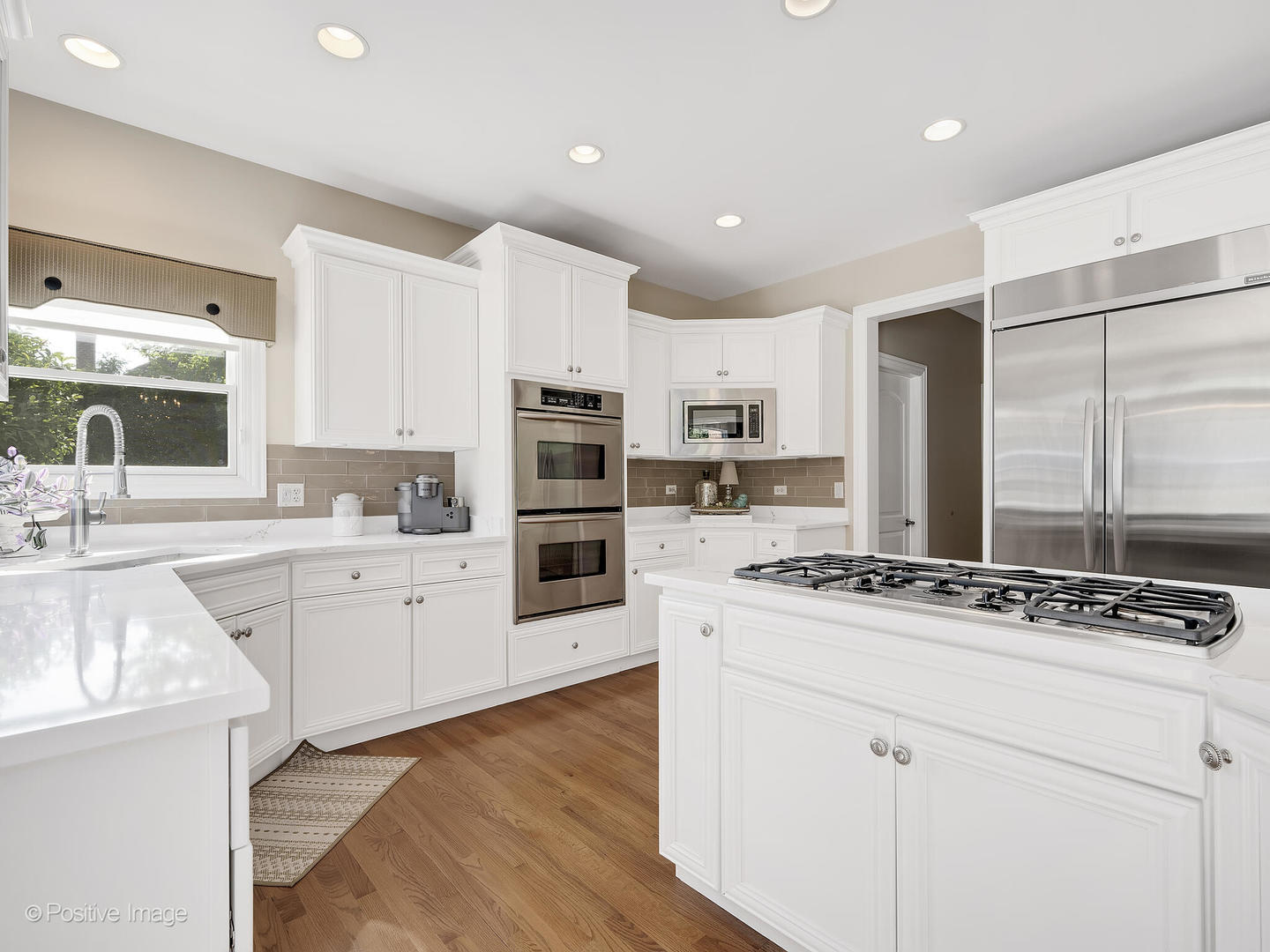 39-w740 Walt Whitman Road St. Charles, IL 60175 - Photo 15 of 39 a kitchen with stainless steel appliances kitchen island granite countertop a stove a sink and white cabinets