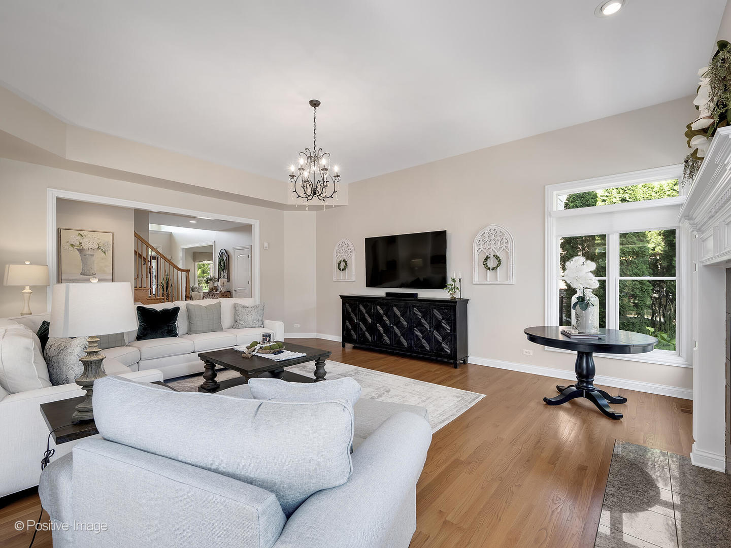 39-w740 Walt Whitman Road St. Charles, IL 60175 - Photo 7 of 39 a living room with furniture a flat screen tv and a large window