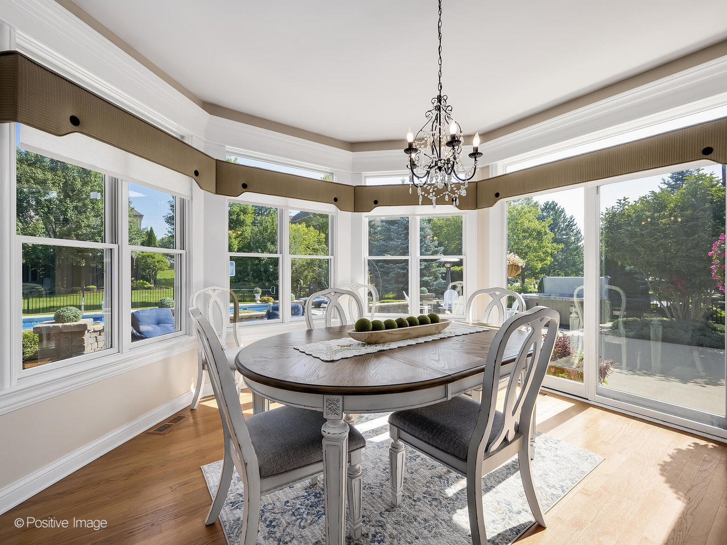 39-w740 Walt Whitman Road St. Charles, IL 60175 - Photo 9 of 39 a dining room with furniture large windows and wooden floor