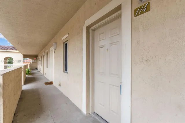 a view of a hallway with white walls