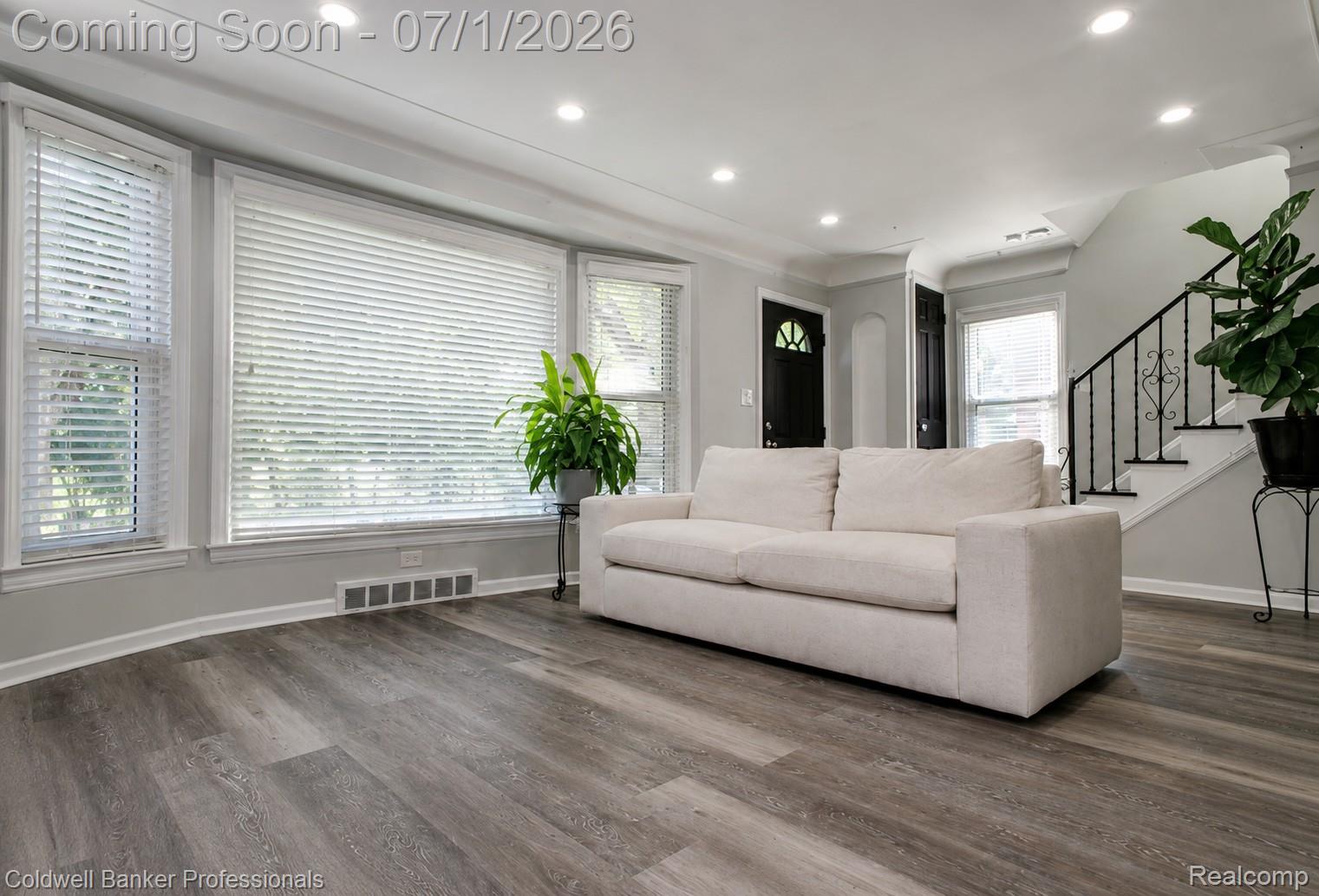 1168 Vernier Road Grosse Pointe, MI 48236 - Photo 7 of 32 Living area featuring wood-finish flooring, recessed lighting, and a bay window with white blinds