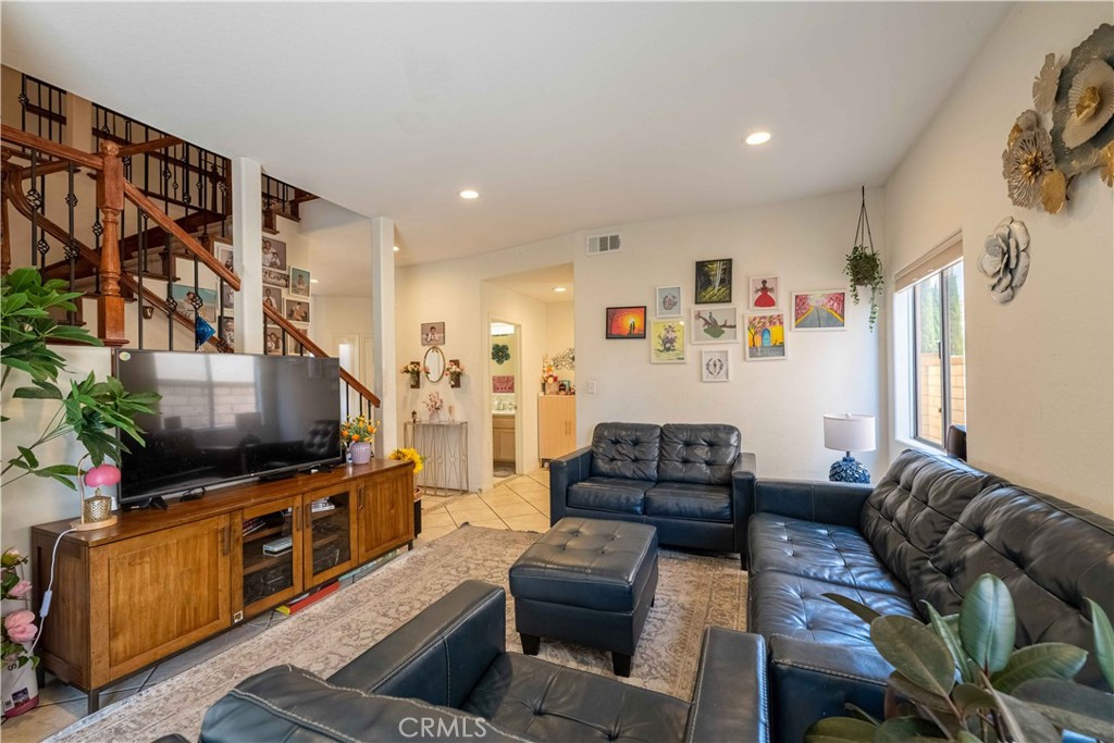 985 Brandon Avenue Simi Valley, CA 93065 - Photo 11 of 48 a living room with furniture and a flat screen tv