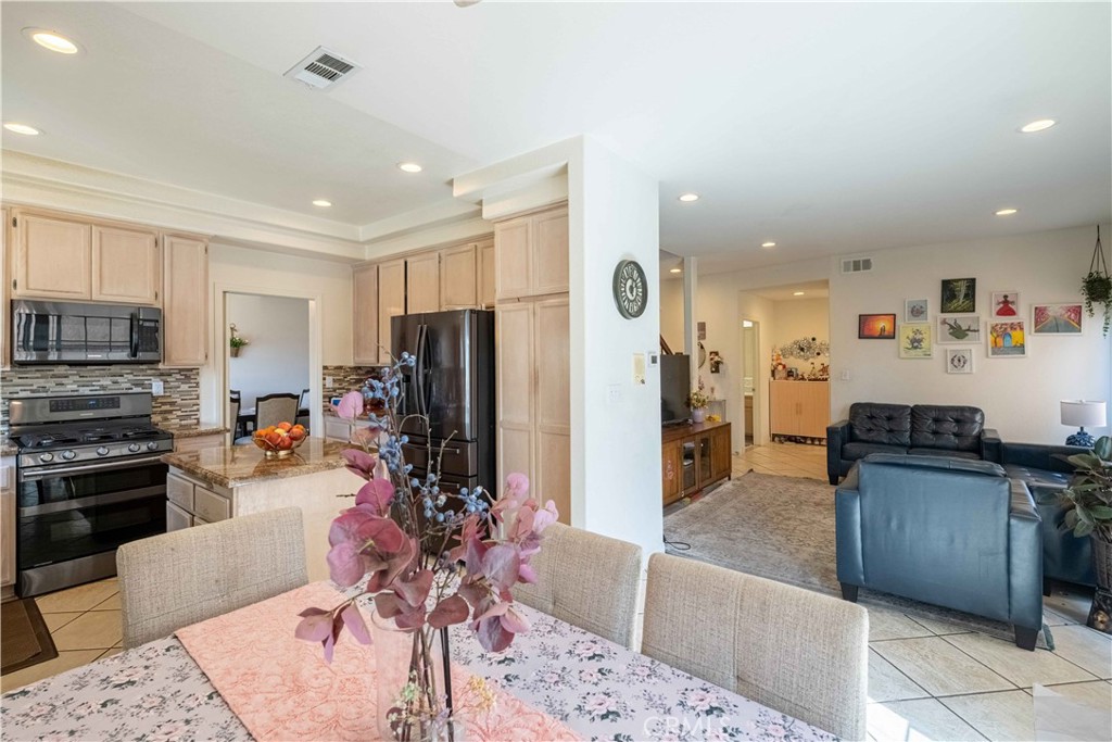 985 Brandon Avenue Simi Valley, CA 93065 - Photo 13 of 48 a living room with stainless steel appliances kitchen island granite countertop a refrigerator and a sink