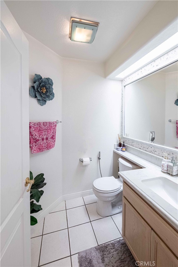 985 Brandon Avenue Simi Valley, CA 93065 - Photo 19 of 48 a bathroom with a sink mirror and toilet