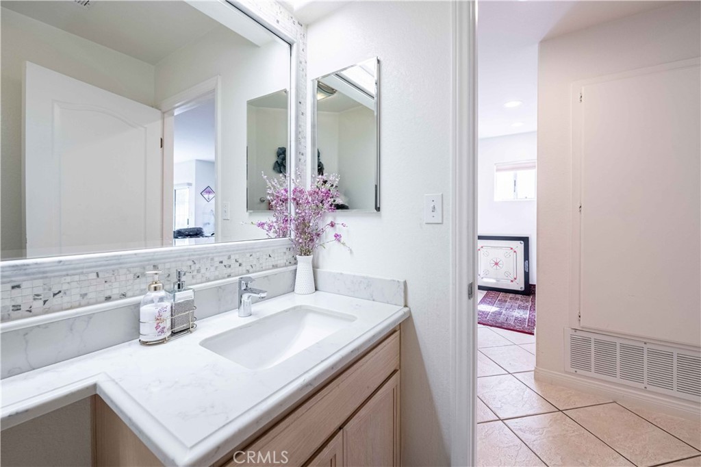 985 Brandon Avenue Simi Valley, CA 93065 - Photo 20 of 48 a bathroom with a sink and a mirror