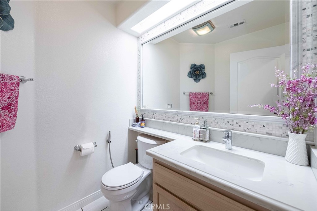 985 Brandon Avenue Simi Valley, CA 93065 - Photo 21 of 48 a bathroom with a sink and a toilet