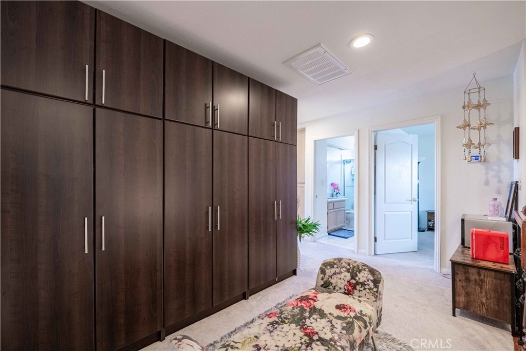 985 Brandon Avenue Simi Valley, CA 93065 - Photo 23 of 48 a bedroom with a bed and a dresser