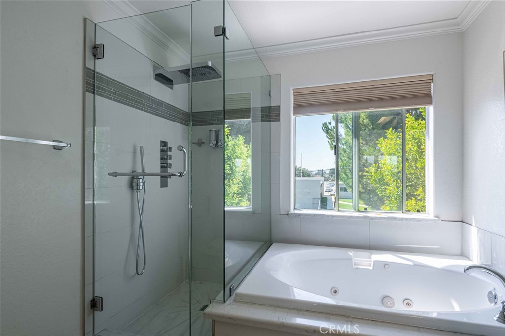 985 Brandon Avenue Simi Valley, CA 93065 - Photo 32 of 48 a bathroom with a bath tub and a shower