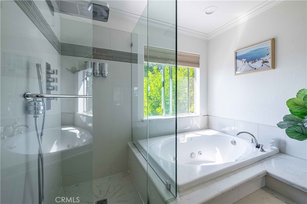 985 Brandon Avenue Simi Valley, CA 93065 - Photo 33 of 48 a bathroom with a tub and a shower