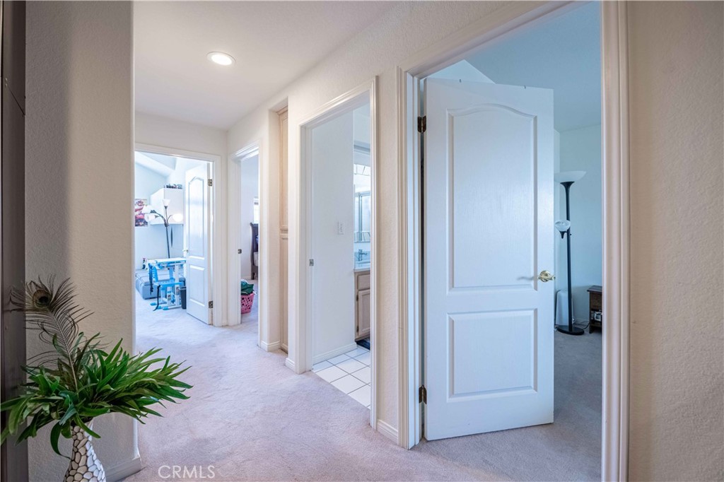 985 Brandon Avenue Simi Valley, CA 93065 - Photo 34 of 48 a view of a hallway with potted plants