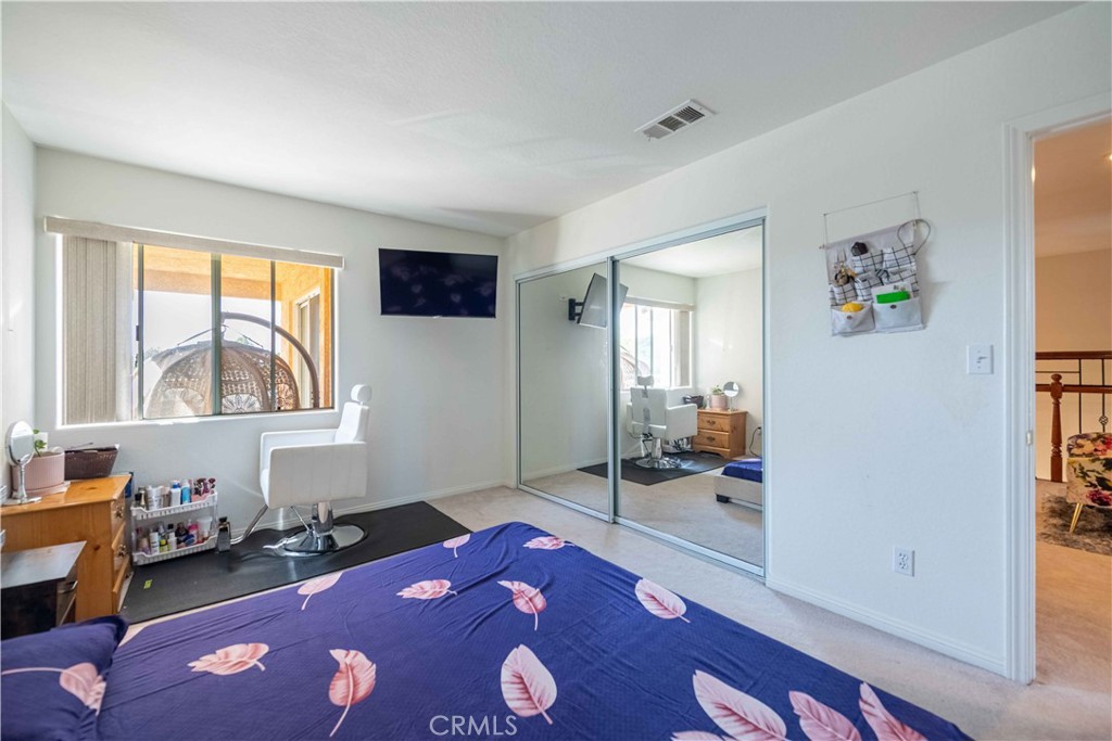 985 Brandon Avenue Simi Valley, CA 93065 - Photo 36 of 48 a bedroom with furniture and a rug