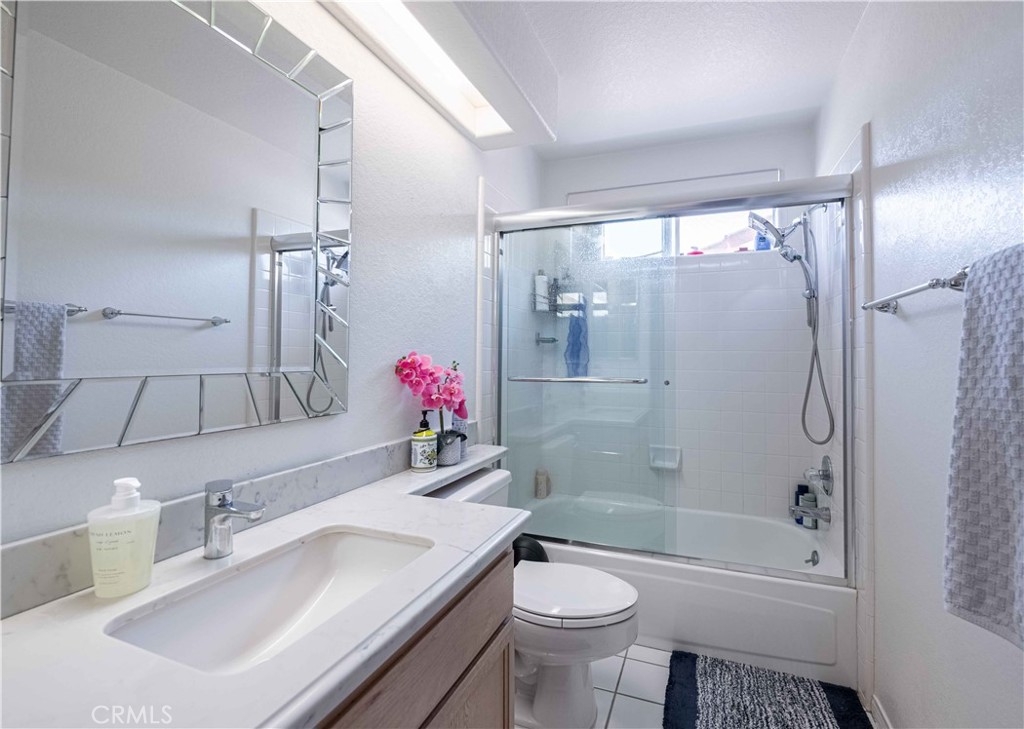985 Brandon Avenue Simi Valley, CA 93065 - Photo 41 of 48 a bathroom with a sink toilet tub and shower