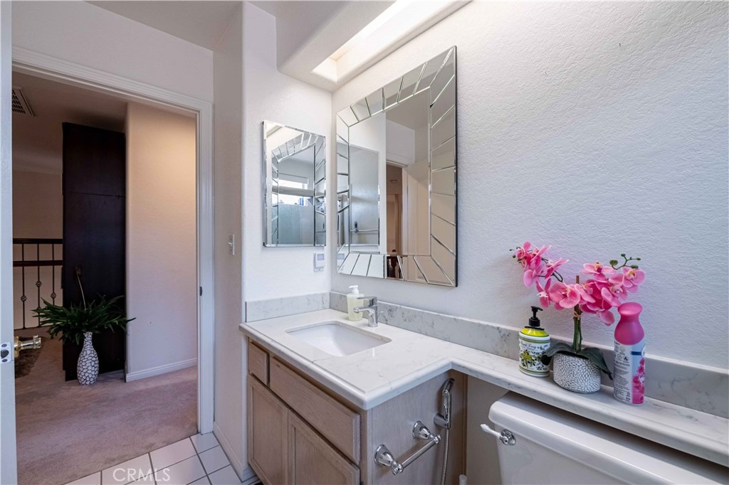 985 Brandon Avenue Simi Valley, CA 93065 - Photo 43 of 48 a bathroom with a sink vanity and a mirror