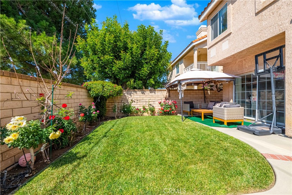 985 Brandon Avenue Simi Valley, CA 93065 - Photo 48 of 48 a view of a house with sitting area and garden