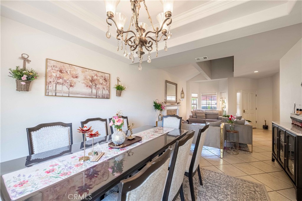 985 Brandon Avenue Simi Valley, CA 93065 - Photo 8 of 48 a view of a dining room with furniture and a chandelier