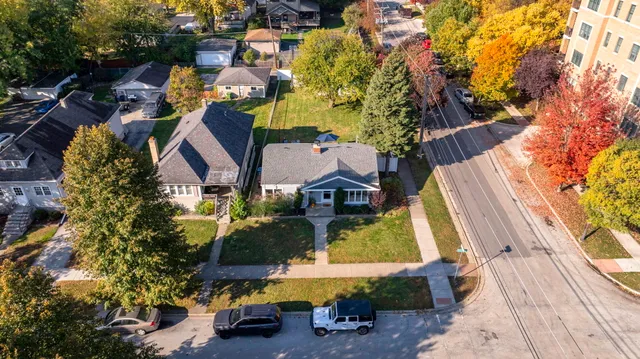 an aerial view of houses with yard