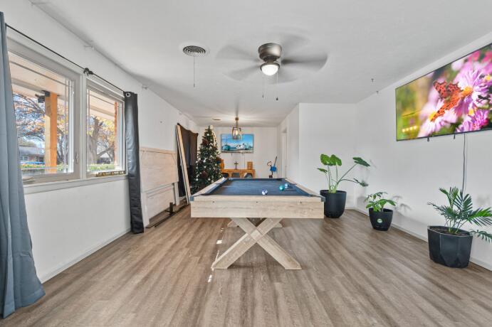 3008 68th Street Lubbock, TX 79413 - Photo 2 of 12 a view of a dining room with furniture window and wooden floor