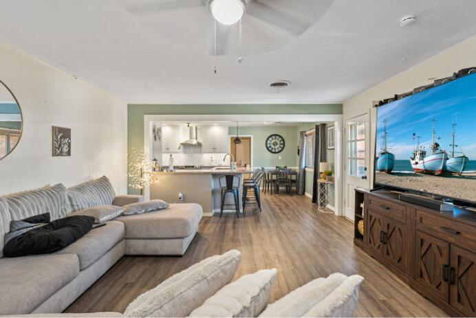 3008 68th Street Lubbock, TX 79413 - Photo 3 of 12 a living room with furniture and a large window