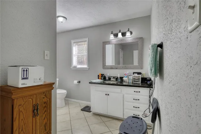 a bathroom with a sink a vanity and a mirror