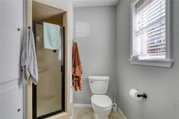a white toilet sitting next to a bathroom sink