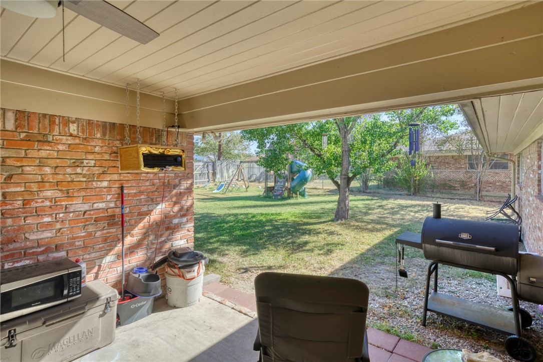 3501 Midwest Drive Bryan, TX 77802 - Photo 27 of 31 a living room filled with furniture and a floor to ceiling window