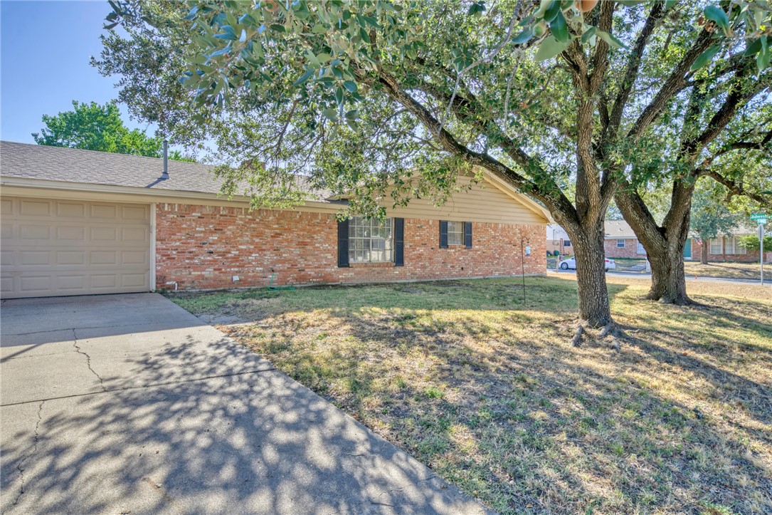 3501 Midwest Drive Bryan, TX 77802 - Photo 31 of 31 front view of a house with a large tree