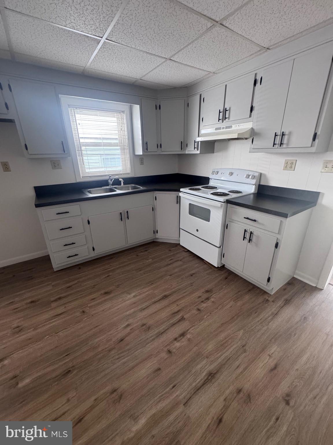 222 Armstrong Street Halifax, PA 17032 - Photo 4 of 18 a large kitchen with stainless steel appliances granite countertop a stove a sink and white cabinets