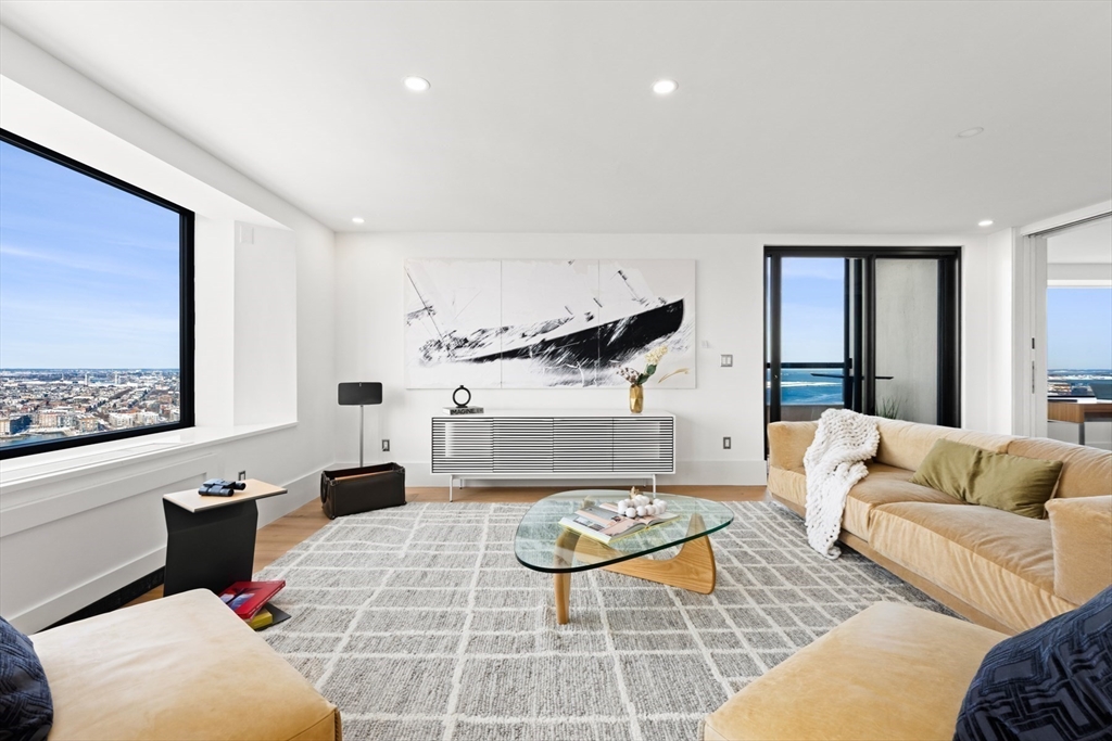 85 East India Row, Unit PHAB Boston, MA 02110 - Photo 16 of 42 a living room with furniture and a rug