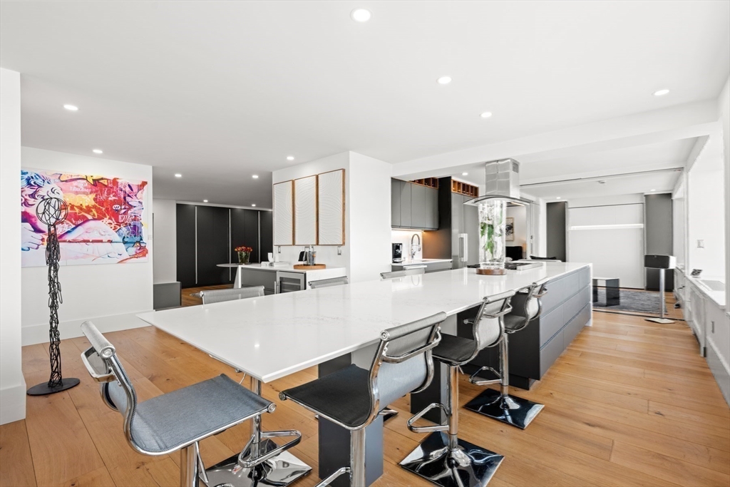 85 East India Row, Unit PHAB Boston, MA 02110 - Photo 22 of 42 a large kitchen with a table and chairs