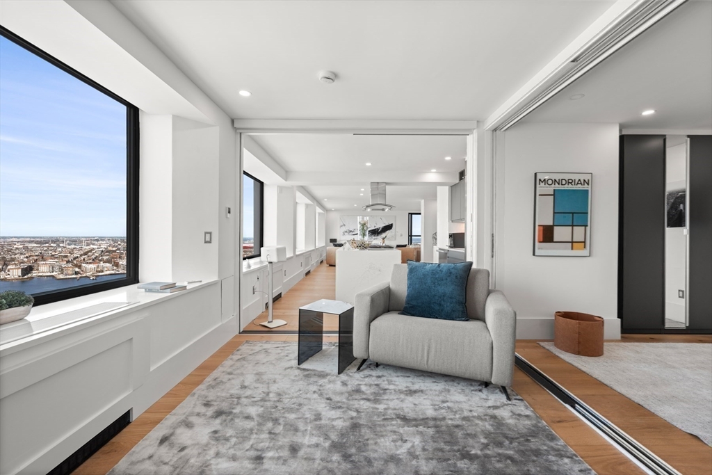 85 East India Row, Unit PHAB Boston, MA 02110 - Photo 28 of 42 a living room with furniture and a couch