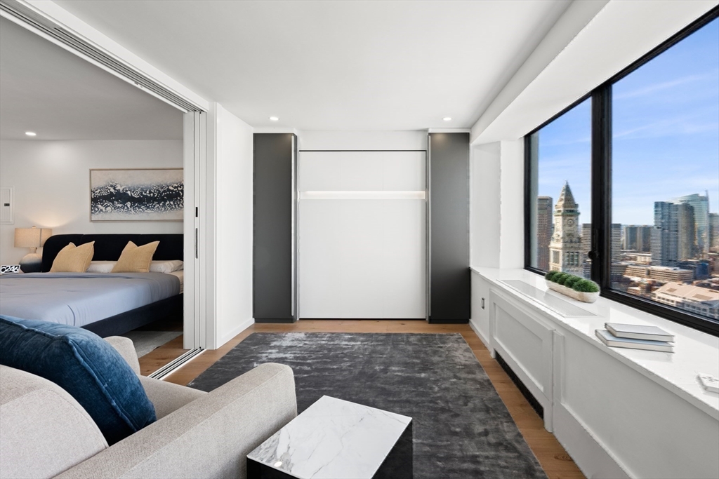 85 East India Row, Unit PHAB Boston, MA 02110 - Photo 30 of 42 a living room with furniture and large window