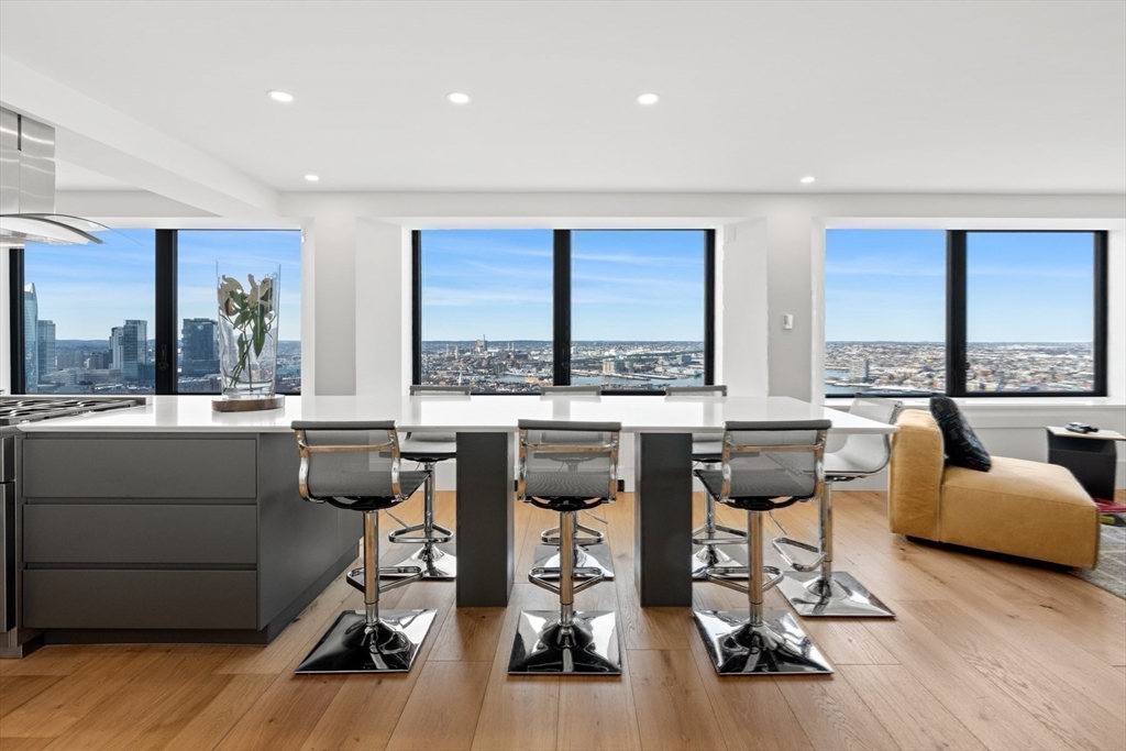 85 East India Row, Unit PHAB Boston, MA 02110 - Photo 4 of 42 a living room with furniture and floor to ceiling window