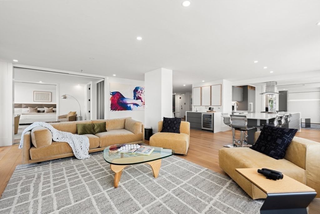 85 East India Row, Unit PHAB Boston, MA 02110 - Photo 6 of 42 a living room with furniture and a view of kitchen