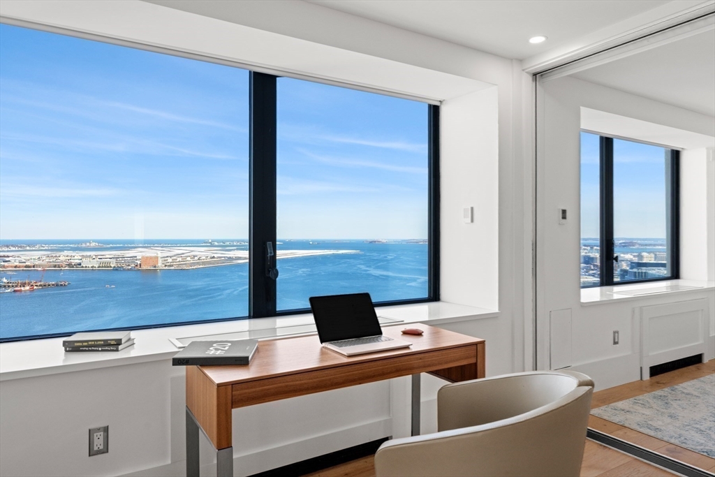 85 East India Row, Unit PHAB Boston, MA 02110 - Photo 9 of 42 a view of a living room and a window