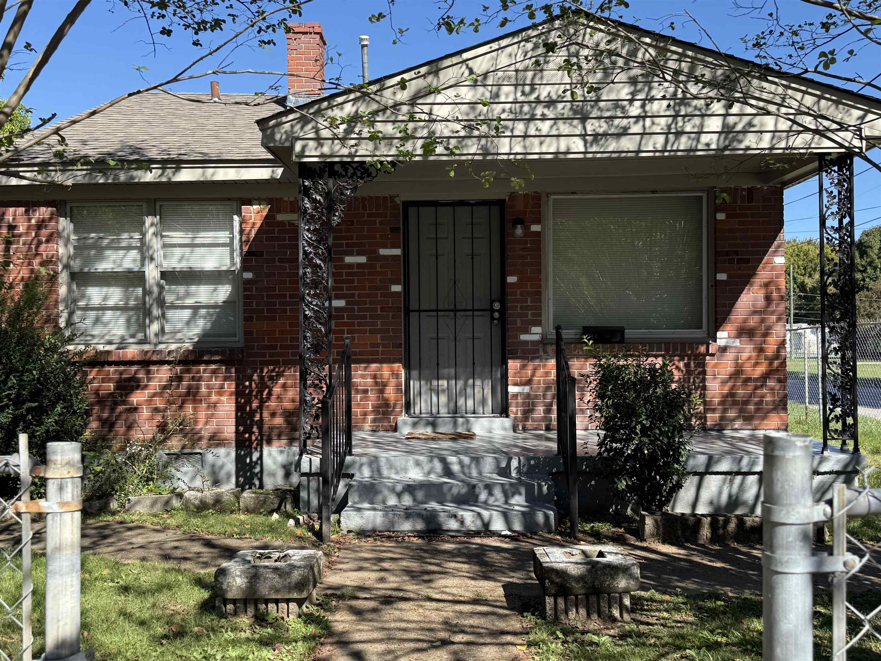 a view of a house with a tree