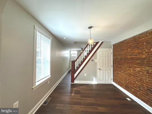 a kitchen with stainless steel appliances kitchen island granite countertop a stove and a sink