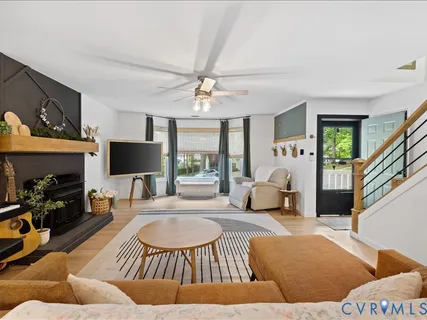 a living room with furniture and a fireplace