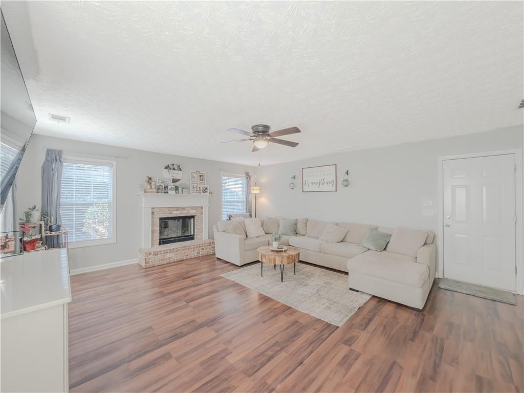 3100 Oak Ridge Lane Loganville, GA 30052 - Photo 16 of 43 a living room with furniture and a fireplace