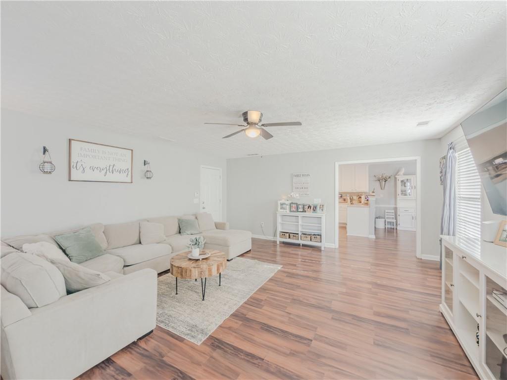 3100 Oak Ridge Lane Loganville, GA 30052 - Photo 17 of 43 a living room with furniture and wooden floor
