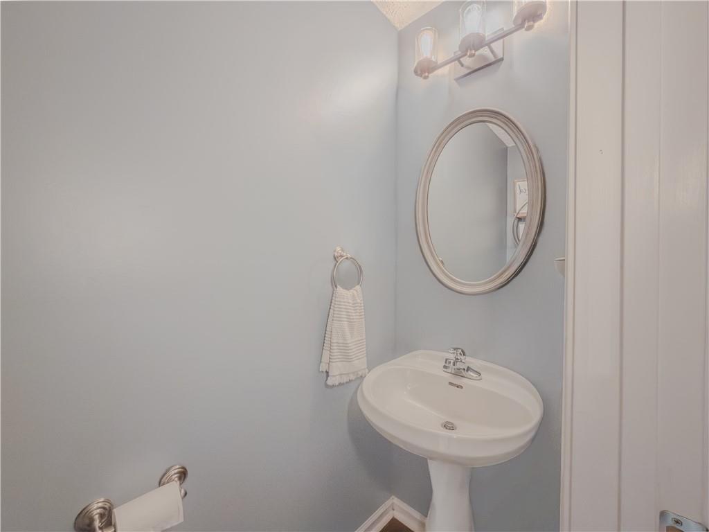 3100 Oak Ridge Lane Loganville, GA 30052 - Photo 19 of 43 a bathroom with a sink and a mirror