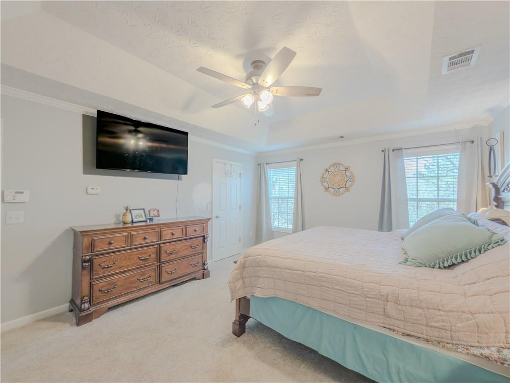 3100 Oak Ridge Lane Loganville, GA 30052 - Photo 21 of 43 a bedroom with a bed and a flat screen tv