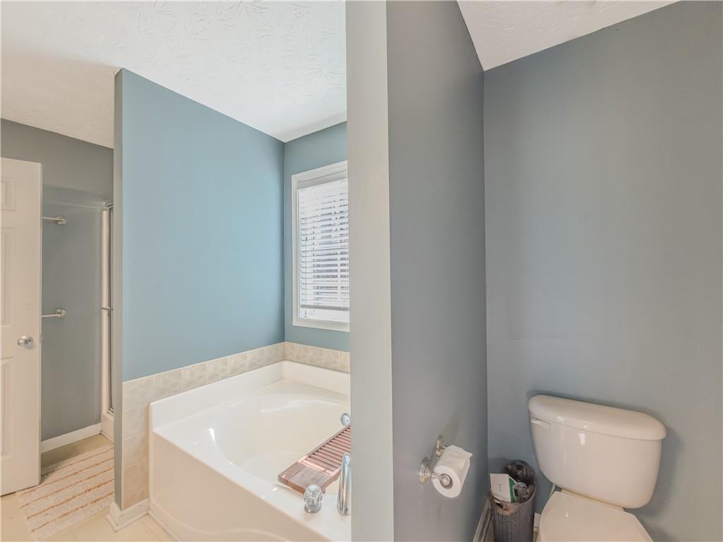 3100 Oak Ridge Lane Loganville, GA 30052 - Photo 24 of 43 a bathroom with a toilet and a sink